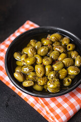 grilled olives fresh fruits in a plate ready to eat portion meal snack on the table copy space food background rustic. top view