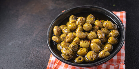 grilled olives fresh fruits in a plate ready to eat portion meal snack on the table copy space food background rustic. top view