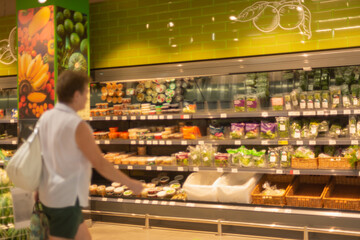 Woman at the grocery store (Blurred). 