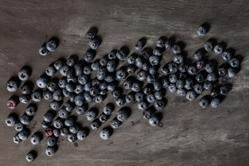 Blueberries on dark grey background. Flatlay, top view.