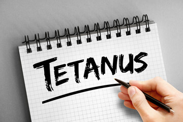 Tetanus text on notepad, health concept background