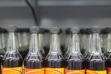 Glass bottles with lids and dark liquid. Paint, enamel, drying oil or oil.