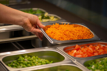 Cutted carrots in the restaurant. Vegetables preparation 