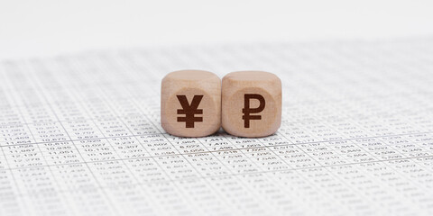 The accounting documents have cubes with pound yen and ruble signs