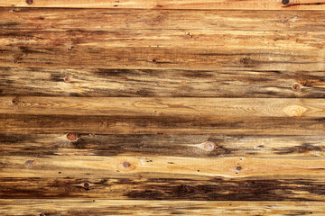 Fototapeta premium Yellow wooden wall with old boards, texture of natural materials.