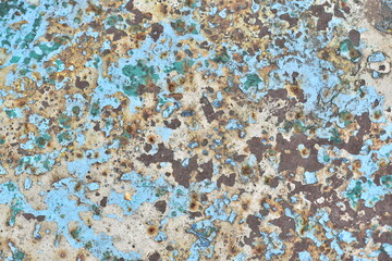 The background is rusty metal, painted with old peeling paint