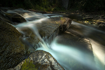 Ethereal water scenics of rivers and streams with a long exposure.  Light trickles in to expose the...
