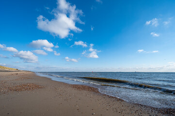 View on white sandy  beach, dunes and water of North sea between Vlissingen en Domburg, Zeeland, Netherlands