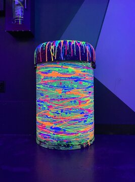 neon painted trash can