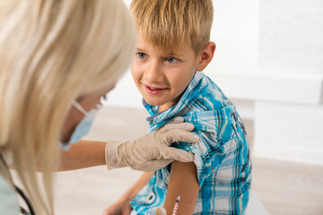 Coronavirus, flu or measles vaccine concept. Medic, doctor, nurse, health practitioner vaccinates...