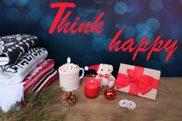 warm colored sweaters, a cup of hot cocoa with marshmallows, candles, gifts, sweets, the concept of merry christmas, cozy winter mood, holiday
