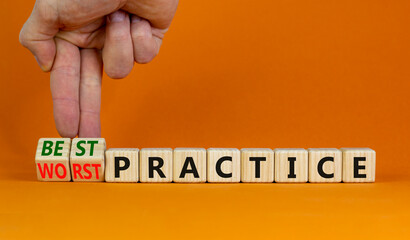 Best or worst practice symbol. Businessman turns wooden cubes and changes words 'worst practice' to...