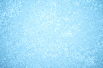 Natural beautiful ice ornament with a frozen pattern of white frost and natural illumination. Background