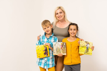 family holding photo canvas on white background. Photo with gallery wrap method of canvas stretching on stretcher bar