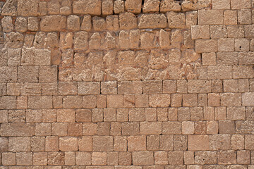 Old weathered stone wall of medieval fortress brick horizontal grunge background