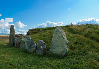 the beautiful aged stone of neolithic chambered tombs at West Kennet Long Barrow, part of the...