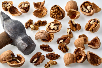 Background from chopped walnuts and a old hammer