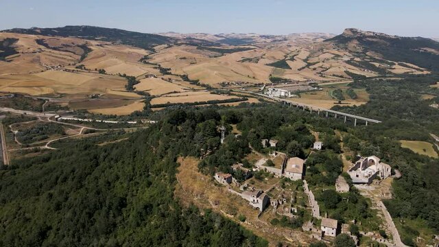 Aerial view of the archeological park at Conza della Campania with Lago di Conza in background, a town destroyed by 1980 Irpinia earthquake, Avellino, Italy.