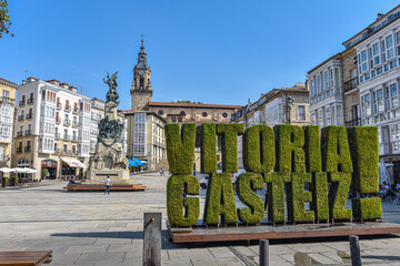 Vitoria Gasteiz, Spain - 21 Aug 2021: Floral Vitoria Gasteiz sign in the Plaza de la Virgen Blanca....