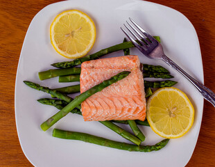 baked salmon  and asparagus  with slice of lemon