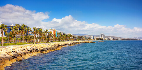 Fototapeta premium The Promenade of Limassol, panorama, tourists are enjoying Cypriot spring on the shores of the Mediterranean sea, Republic of Cyprus