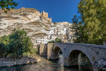 Alcala del Jucar, Spain. Picturesque and touristy white town in a meander of the Jucar river with a...