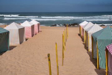 different colors textil beach tents with stripes