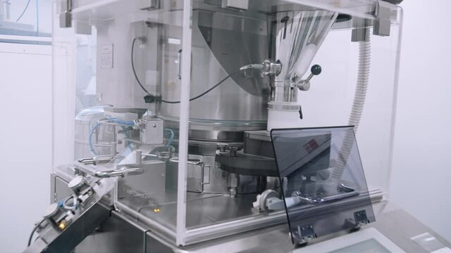 spinning tablets on pharmaceutical conveyor factory Spbd. test production of pills on pharmaceutical laboratory. automated production of vitamin. concept healthcare