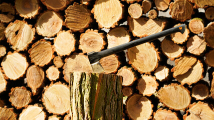 Ax in a log, densely packed firewood close-up