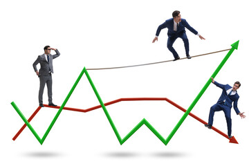 Fototapeta premium Businessman balancing on tightrope on line chart