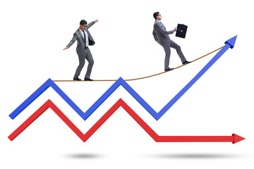 Businessman balancing on tightrope on line chart