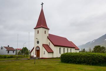 Fototapeta na wymiar Church of town of Flateyri in Onundarfjordur in Iceland