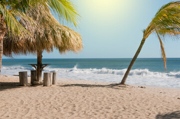 A beach hut near the waves, a beach hut with palm trees, concept vacations