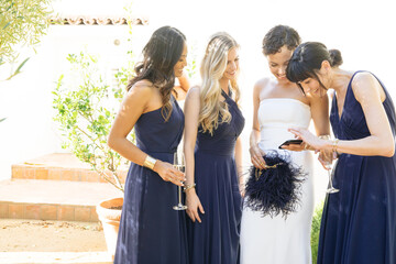 Bridal party taking pictures before wedding