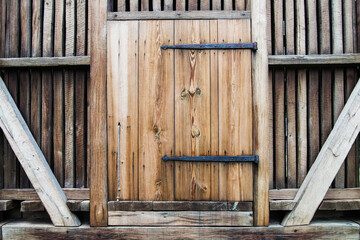 wooden barn door with iron awnings
