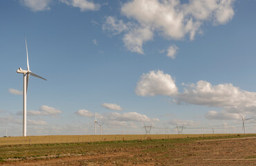 Fototapeta na wymiar landscape with clean energy generating windmills.