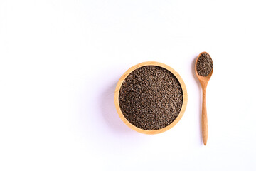 Perilla seeds in a wooden bowl and spoon on white background, Healthy herbal seed ingredients in Asian food, Top view