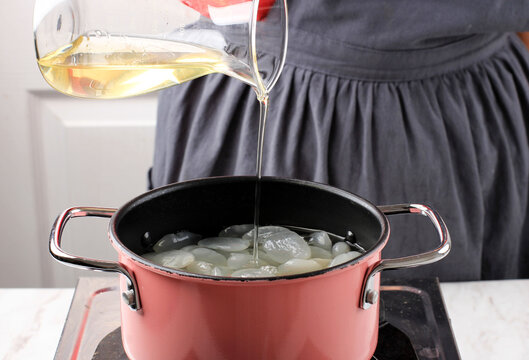 Pour Simple Syrup or Sugar Syrup or Liquid Sugar to the Pan, Process Making Manisan Kolang Kaling (Sugar Palm Fruit) for Ramadan or Ied Fitr