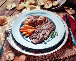 steak with carrots and mushrooms