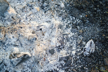 Pile of ashes after the fire went out. Ash texture.Burned out ashes grunge texture