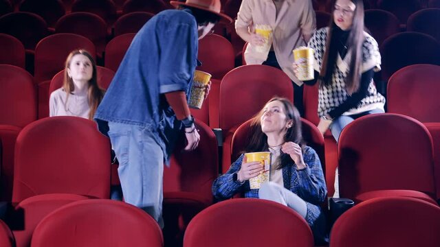 Viewers taking their seats in the cinema