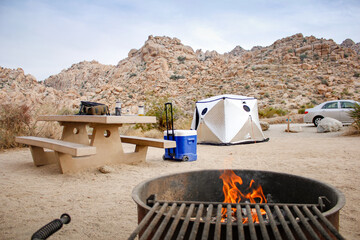 A view of a campground among the rocky terrain of Joshua National Park.