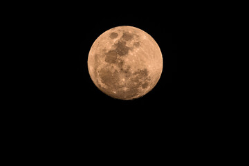 Obraz premium Ninety Nine Percent Full Moon in a hazy smoky night sky