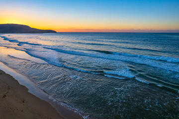 Aerial sunrise over the sea with clear skies