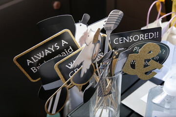  A view of several wedding reception photo booth signs.
