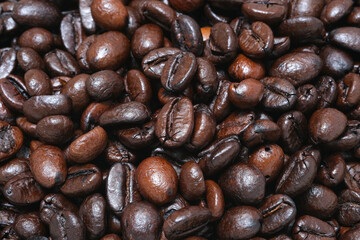 Image of black ground coffee beans, freshly roasted, ground coffee