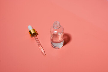 Dropper glass bottles with pipette. Transparent hyaluronic natural beauty product and eco serum skin care concept. Top horizontal view copyspace.