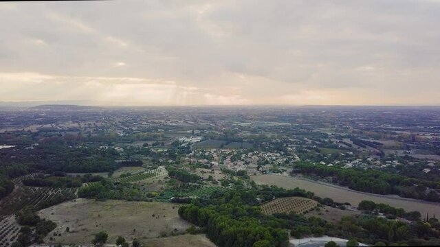 Aerial View of Provence Valley with a Sunset and Cloudy Sky and Village