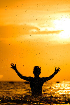 silhouettes of people on the sea, warm sunshine on the morning, at Haadrin beach, koh phangan, surathhani , thailand
