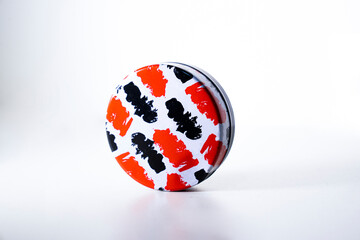 Metallic Sphere with Black and Red Stripes